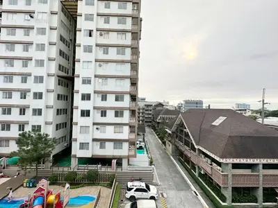 a view of a building with cars parked in a parking lot at SweetSuites at Pine Crest #T1-526 in Manila