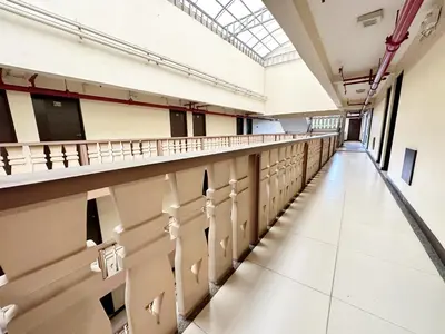 an empty hallway in a building with a glass ceiling at SweetSuites at Pine Crest #T1-526 in Manila