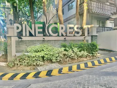 a sign for the entrance to a building at SweetSuites at Pine Crest #T1-526 in Manila