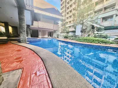 a swimming pool in the middle of a building at SweetSuites at Pine Crest #T1-526 in Manila