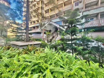 a building with a bunch of plants in front of it at SweetSuites at Pine Crest #T1-526 in Manila