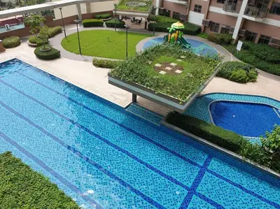 an overhead view of a swimming pool in a building at The Radiance by Dominga in Manila