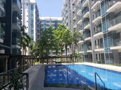 a swimming pool in the middle of a building at Lovely 2 Bed Room condo infront of NAIA Terminal 3 in Manila