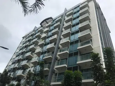 a tall building with trees in front of it at Lovely 2 Bed Room condo infront of NAIA Terminal 3 in Manila