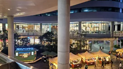 arium of a shopping mall with people walking around it at Awesome Value, Great Location in Manila