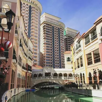 a river in a city with tall buildings at 1BR Studio at viceroy McKinley taguig in Manila