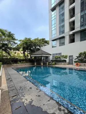 a swimming pool in front of a building at 1BR Studio at viceroy McKinley taguig in Manila