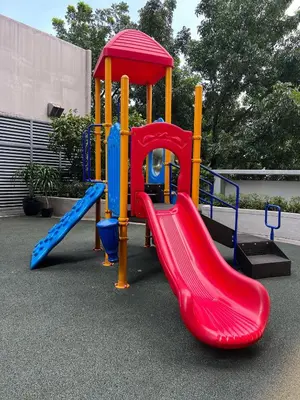 a playground with a red and blue slide at 1BR Studio at viceroy McKinley taguig in Manila