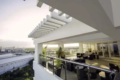 a building with a balcony with a view of a living room at Staycation budget room in Manila