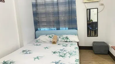 a small bedroom with a bed in a room at Staycation budget room in Manila