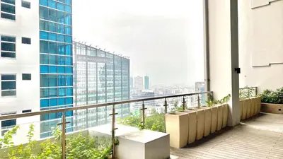 an apartment balcony with a view of a city at Lovely 1 Bedroom City View in Uptown BGC in Manila