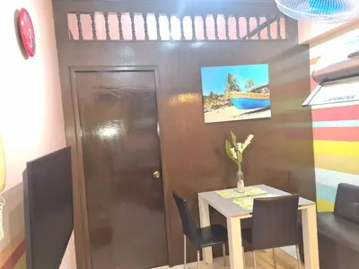 a dining room with a table and chairs at Affordable Transient along Ortigas Ext near Cainta/Pasig in Cainta