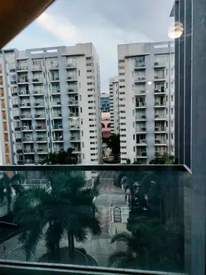 a view of some buildings from a window at RQUI CONDOTEL NEAR AIRPORT & Resorts World Manila in Manila