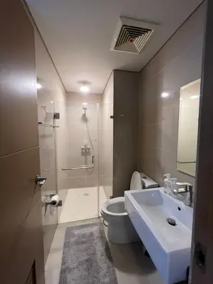 a bathroom with a toilet and a sink and a shower at 2 Palm Tree Villas - Manila Terminal 3 Airport Pasay in Manila