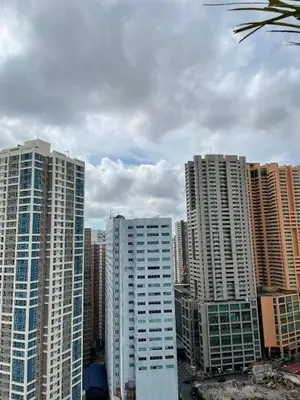 a group of tall buildings in a city at U806 2Bedrooms PoolAccess Netflix wifi85mbps Karaoke in Manila