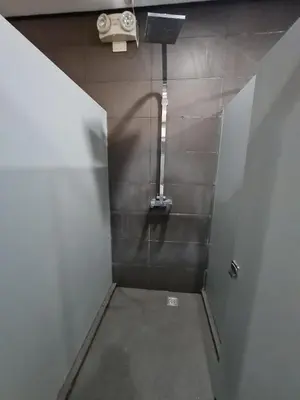 a bathroom with a walk in shower with a light at U806 2Bedrooms PoolAccess Netflix wifi85mbps Karaoke in Manila