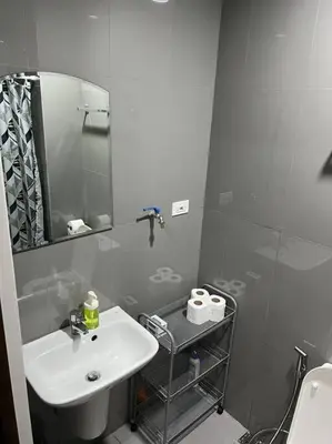 a bathroom with a sink and a mirror at Air Residences - 1Bedroom Unit with Balcony - Wifi & Netflix in Manila