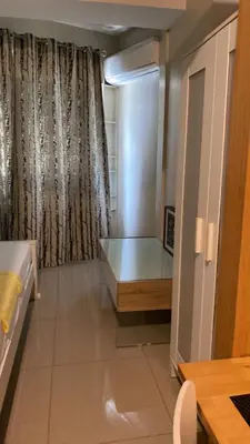 a room with a bed and a window at SHELL RESIDENCE c7 shortwalk MALL OF ASIA in Manila