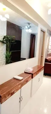 a bathroom with a wooden counter and a mirror at MOA S Residences 1BR Condo Stunning Boutique T3 in Manila