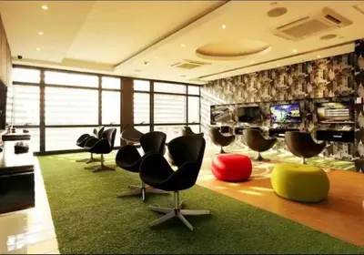 a room with a bunch of chairs and a television at Makati - Sleeps 2 - Pool - Cinema - Gym - Garden in Manila