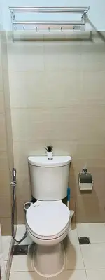 a bathroom with a toilet with a plant on top of it at Staycation by Janeil at Shore 2 Residences SMDC, MOA Complex, Pasay City, Philippines in Manila