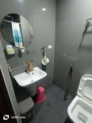 a bathroom with a sink and a mirror at Cruz Air Residences in Manila