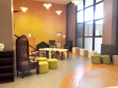 a room with a table and chairs and a room with a table at The Radiance Manila Bay - Modern 1-Bedroom Condo with View in Manila