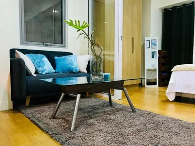 a living room with a couch and a coffee table at Acqua Private Residence Livingstone Tower Condo Unit with Free Wifi in Manila