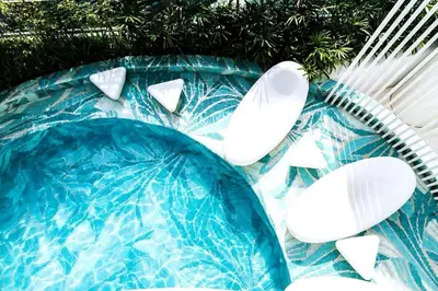 a swimming pool with white decorations on top of it at Acqua Private Residence Livingstone Tower Condo Unit with Free Wifi in Manila