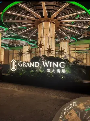 a grand wing sign in front of a building at Salamat Place Original in Manila