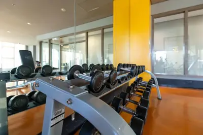 a row of dumbbells in a gym at The Radiance Manila Bay in Manila