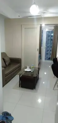 a living room with a couch and a coffee table at Jazz Residences by Destina Stays, Makati, Metro Manila in Manila