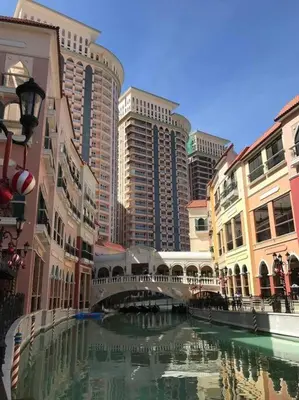 a river in a city with buildings and a bridge at Studio at viceroy t4 Florence way in Manila