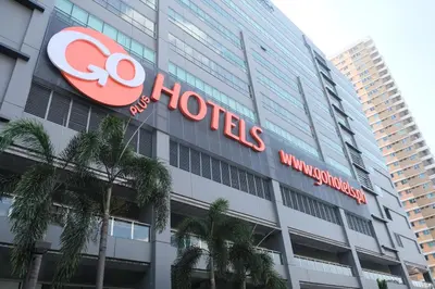 a hotel sign on the side of a building at Go Hotels Plus Mandaluyong in Manila