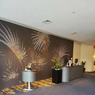 a lobby with a wall with fireworks painted on it at Go Hotels Plus Mandaluyong in Manila