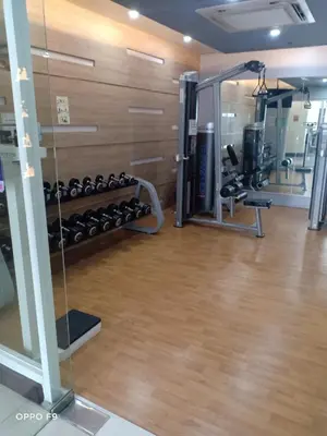 a gym with lots of equipment in a room at MRMCONDOTEL in Manila