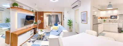 two pictures of a living room and a kitchen at Large 1-Bedroom Condo 60sqm Makati Rockwell CBD Poblacion in Manila