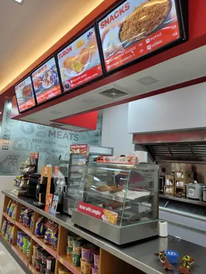 a fast food restaurant with a counter with food at StayInMyCondo - 8th Condo in Pasay near NAIA Airport, MOA Pasay in Manila