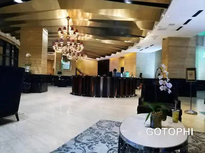 a large lobby with a table and a chandelier at the Gramercy Residences NEW RELEASE in Manila