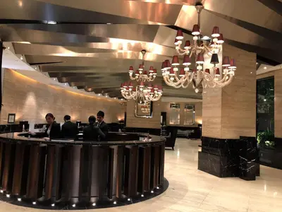 a group of people sitting at a bar in a restaurant at the Gramercy Residences NEW RELEASE in Manila