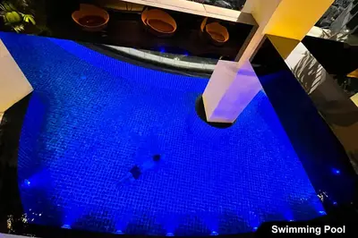 a swimming pool with blue water in a building at the Gramercy Residences NEW RELEASE in Manila