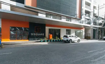 a white car parked in front of a store at RedDoorz Plus near Nakpil St Taft Avenue in Manila