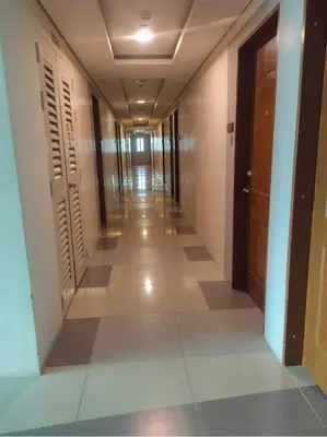 an empty hallway in a building with a hallway at Beacon Makati Condo Free POOL Access FREE WIFI 100mbps & FREE Netflix in Manila