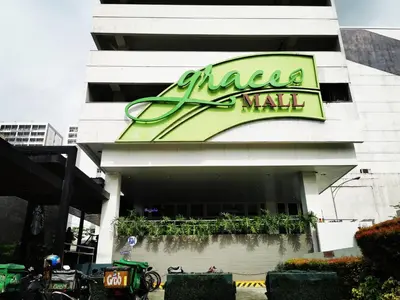 a mall sign on the side of a building at Ethan's Pad Nr. BGC in Manila