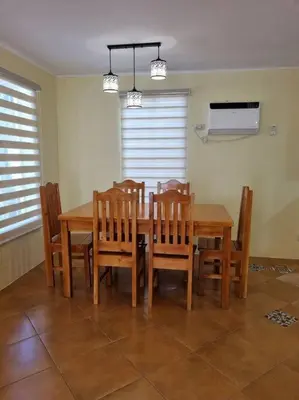 a dining room with a wooden table and chairs at #30 Bel Air House by Red Door House Rental in Santa Rosa
