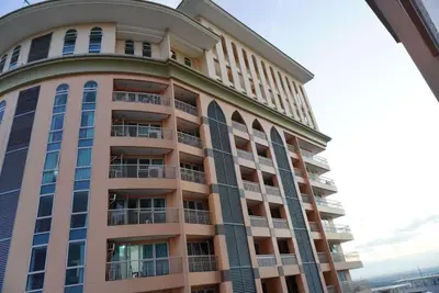 a building with balconies on the side of it at Premium Executive Suite at Venice Luxury Residences in Manila