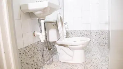 a bathroom with a toilet and a sink at Hive Manila Guesthouse -Netflix,400mbps WI-FI in Bacoor