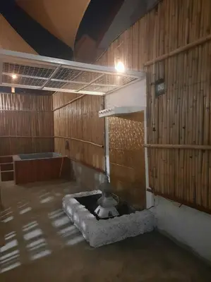 a room with a dog laying in a bath tub at Omotenashi House of Santa Rosa City Laguna in Caingin