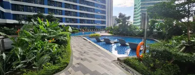 a swimming pool in the middle of a building at SMDC AIR RESIDENCES in Manila