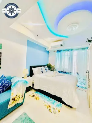 a bedroom with two beds and a blue ceiling at Ocean theme Navy Blue Deluxe Suite with PS4 and Balcony overlooking Manila Bay and Manila Zoo plus near Manila Yacht Club and Star City in Manila